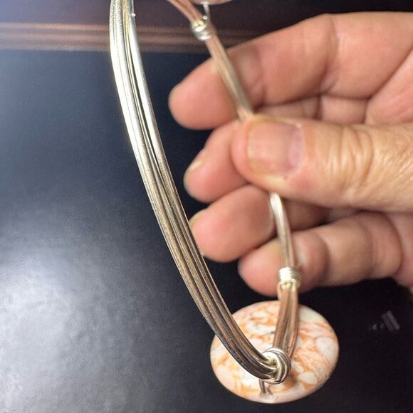 Silver wired metal bracelet with two oval brown swirled stones - Picture 2 of 8